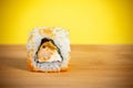 Sushi rolls close-up on a bamboo Board and a bright yellow background Royalty Free Stock Photo