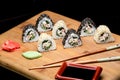 Sushi rolls with crab meat covered with sesame seeds. Royalty Free Stock Photo