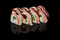 Sushi rolls with cream cheese, hiyashi wakame and salmon Royalty Free Stock Photo