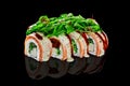 Sushi rolls with cream cheese, hiyashi wakame, salmon served with greens