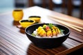 sushi rolls with fresh mango and sticky rice on ceramic bowl Royalty Free Stock Photo