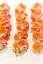 Sushi Rolls with Kani, Cucumber and Avocado on top with Salmon and Ikura