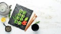 Sushi rolls - Kyoto with salmon, cucumber and Chuka salad. Sushi menu bar.