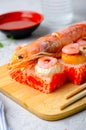 Sushi Rolls with Langoustine and Shrimps, Baked Sushi Rolls Seafood and Crab, Cream Cheese Topped Royalty Free Stock Photo