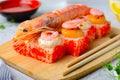 Sushi Rolls with Langoustine and Shrimps, Baked Sushi Rolls Seafood and Crab, Cream Cheese Topped Royalty Free Stock Photo