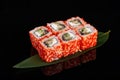 Sushi rolls made of rice, smoked eel, cream cheese and flying fish roe - tobiko caviar Royalty Free Stock Photo