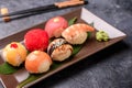 Sushi rolls made of rice, smoked eel, cream cheese and flying fish roeSet hot rolls with avacado, salmon, cream cheese, seaweed, Royalty Free Stock Photo