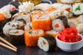 Sushi rolls, maki, nigiri Set served for two on black stone slate on dark background Royalty Free Stock Photo