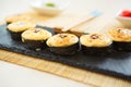 Sushi rolls, maki, nigiri Set served for two on black stone slate on dark background copy space Royalty Free Stock Photo