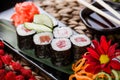 Sushi Rolls - Maki Sushi sashimi decorated with flowers. Japanese cuisine. Selective focus. Royalty Free Stock Photo