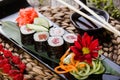 Sushi Rolls - Maki Sushi sashimi decorated with flowers. Japanese cuisine. Royalty Free Stock Photo