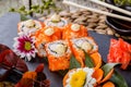 Sushi Rolls - Maki Sushi sashimi decorated with flowers. Japanese cuisine. Royalty Free Stock Photo