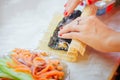 Sushi rolls making hands at home Royalty Free Stock Photo