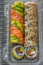 Sushi rolls mix on transaparent plastic container Royalty Free Stock Photo
