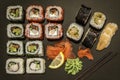 Sushi and sushi rolls, sushi nigiri on stone plate on dark background Royalty Free Stock Photo