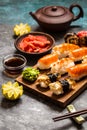 Sushi and sushi rolls, sushi nigiri on stone plate on dark background Royalty Free Stock Photo