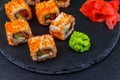 Sushi rolls Philadelphia on black slate