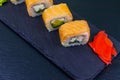 Sushi rolls Philadelphia on black slate