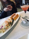 sushi rolls and a pink margareta and a texter Royalty Free Stock Photo