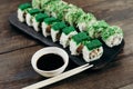 Sushi rolls plate with sauce and chopsticks Royalty Free Stock Photo