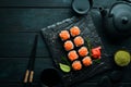 Sushi rolls with salmon and caviar. Traditional Japanese cuisine. Royalty Free Stock Photo