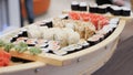 Sushi Rolls with Salmon Grig Served on Wood Tray