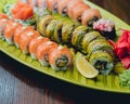 Sushi and rolls with salmon, prawn, avocado, cream cheese. Royalty Free Stock Photo