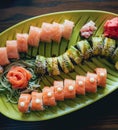 Sushi and rolls with salmon, prawn, avocado, cream cheese. Royalty Free Stock Photo