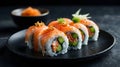Sushi Rolls with Salmon, Veggies, and Sauce Royalty Free Stock Photo
