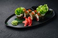 Sushi rolls served on stone slate red caviar Royalty Free Stock Photo