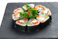 Sushi rolls set on black board on isolated white background Royalty Free Stock Photo