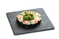 Sushi rolls set on black board on isolated white background Royalty Free Stock Photo