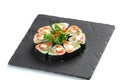 Sushi rolls set on black board on isolated white background Royalty Free Stock Photo