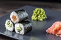 Sushi rolls set. Kappamaki and Sakemaki with pickled ginger and wasabi sauce Royalty Free Stock Photo