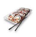 Sushi rolls set in plastic box with black chopsticks isolated on white background Royalty Free Stock Photo