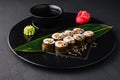 Sushi Rolls Set with Salmon on black plate Royalty Free Stock Photo