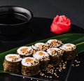 Sushi Rolls Set with Salmon on black plate Royalty Free Stock Photo