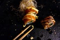 Sushi rolls set served on black stone slate on dark background Royalty Free Stock Photo