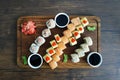 Sushi rolls set served on black stone slate on dark background Royalty Free Stock Photo