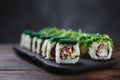 Sushi rolls set served on wooden tray Royalty Free Stock Photo