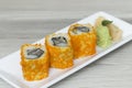 Sushi rolls with shrimps eggs and seaweed