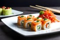 Sushi rolls on a white flat plate on a black background Royalty Free Stock Photo
