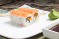 Sushi rolls in white plate with chopsticks and japanese spices Royalty Free Stock Photo