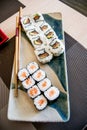 Sushi with salmon, avocado and tuna fish on a plate with chopsticks Royalty Free Stock Photo