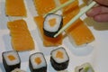 Sushi, salmon maki with sticks Royalty Free Stock Photo