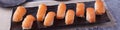 Sushi Salmon Nigiri on dark tray panoramic Royalty Free Stock Photo