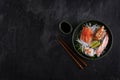 Sushi sashimi set on dark stone slate background. Salmon, scallop, eel and prawn with caviar Royalty Free Stock Photo