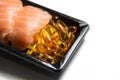 Sushi served with fish oil pills isolated Royalty Free Stock Photo