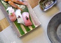 The sushi set is beautifully arranged on ceramic plate. Japanese Cuisine Buffet. Chef`s Choice: Shrimp, Tuna, Nodoguro and KINKI Royalty Free Stock Photo