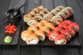 Sushi set on black stone plate. Variety of rolls. Japanese food. Sushi Set concept. Menu. Top view. Royalty Free Stock Photo